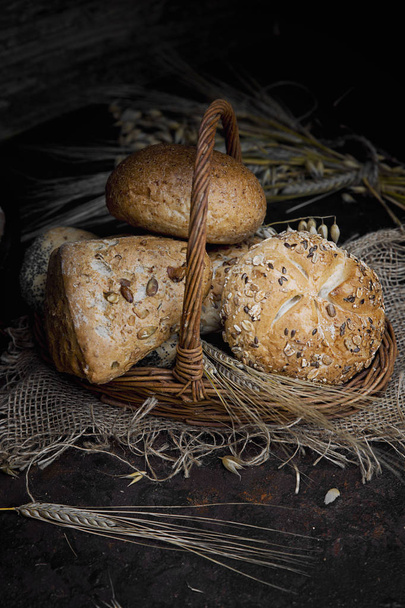 Baked breads in basket - Fotoğraf, Görsel