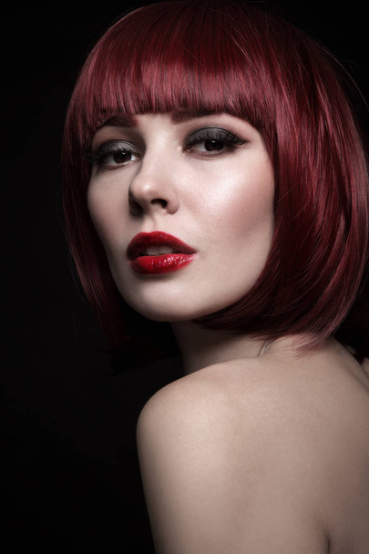 Portrait of young beautiful red-haired girl with bob haircut and stylish make-up - Foto, Imagen