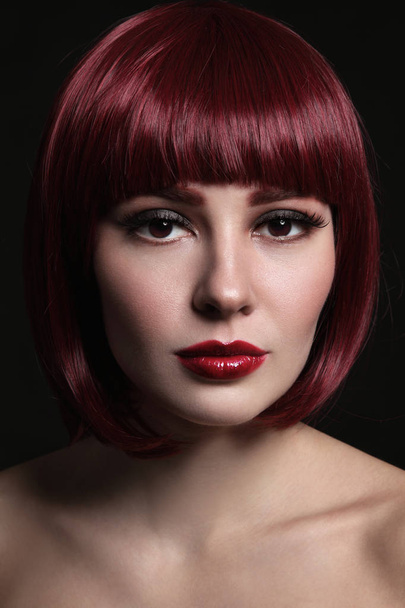 Portrait of young beautiful red-haired girl with bob haircut and stylish make-up - Fotoğraf, Görsel