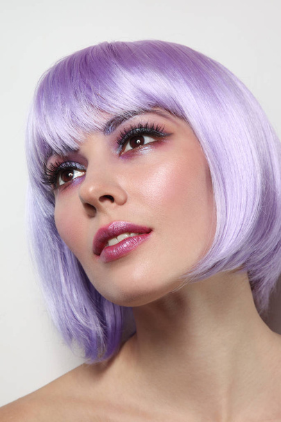 Young beautiful sexy girl with violet hair and fancy make-up - Foto, immagini