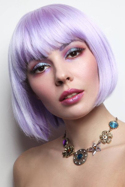 Young beautiful sexy girl with violet hair and fancy make-up - Foto, Imagen