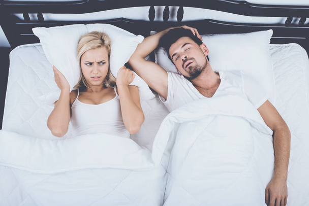 Top View of Man Snoring Loudly Wife Blocks Ears - Photo, Image