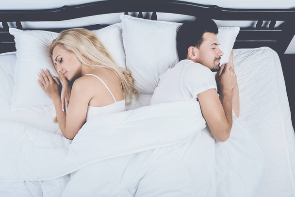 Top View of Young Couple Sleeping in Bed at Home - Photo, Image