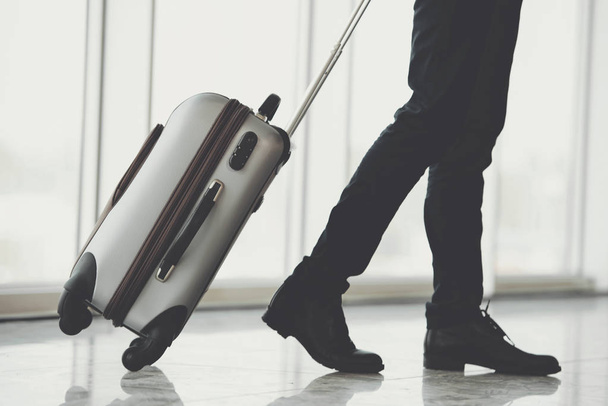 Businessman Running with Luggage in Airport - Foto, imagen