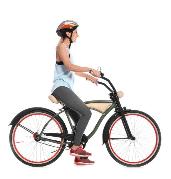 Portrait of sporty woman with bicycle on white background - Φωτογραφία, εικόνα