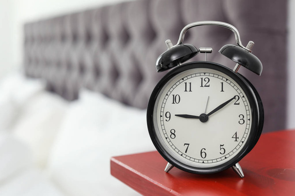 Alarm clock on bedside table. Time to wake up - Valokuva, kuva