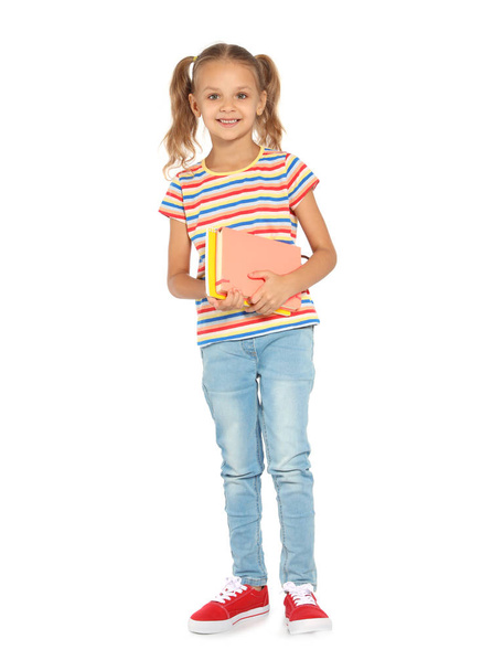 Little child with school supplies on white background - 写真・画像