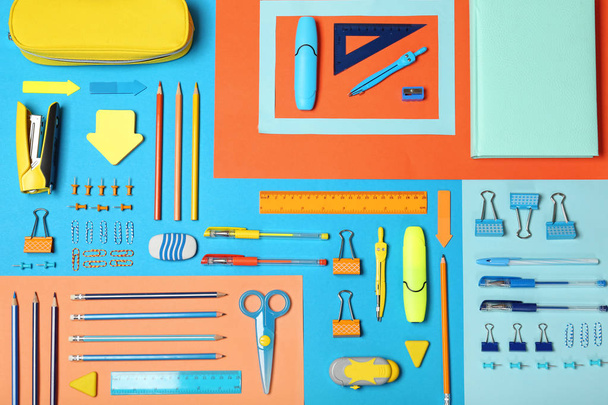 Flat lay composition with different school stationery on color background - Фото, изображение