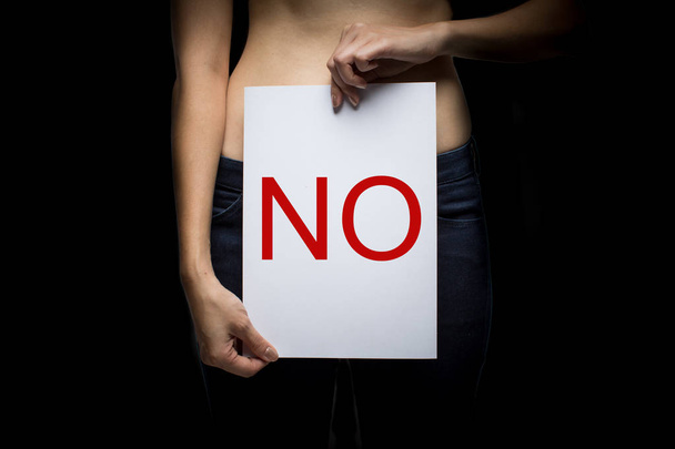 Woman holding paper with word sex with word no - Foto, Imagen
