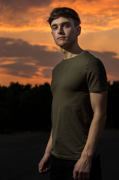 Young male adult outside at sunset - Valokuva, kuva
