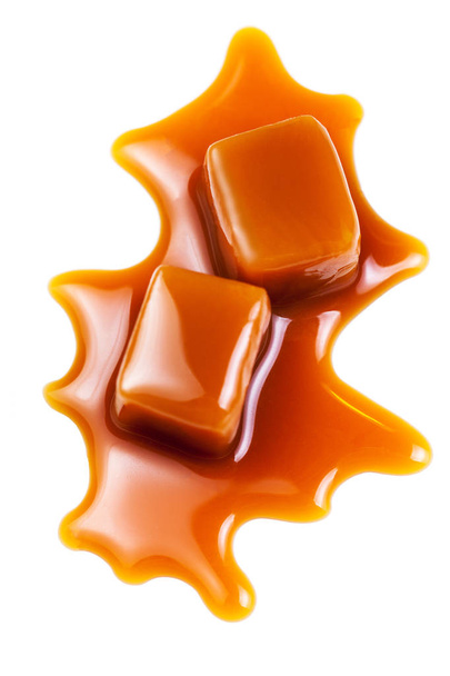 Sweet Caramel sauce flowing isolated on white background - Photo, image