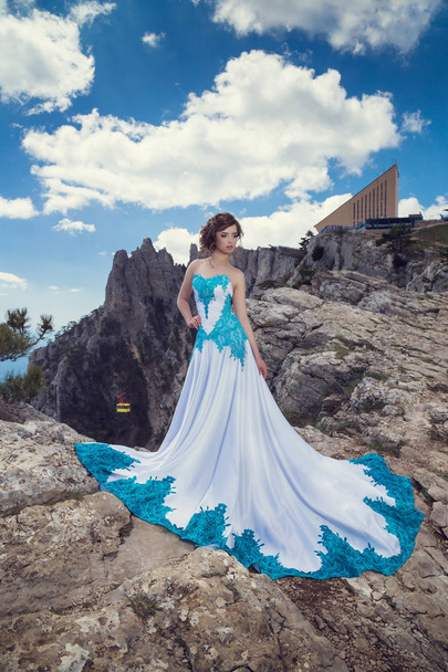 Beautiful sexy woman glamour fashion model wearing  stylish and posing. Crimea. Mount Ai-Petri - Photo, Image