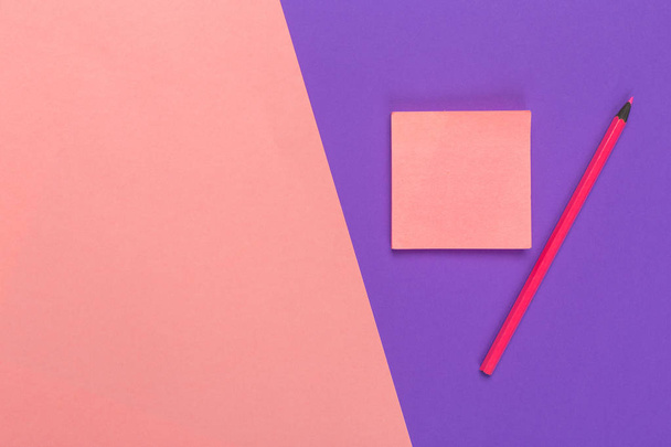 Blank paper notepad on bright bicolor background for your design, top view - 写真・画像