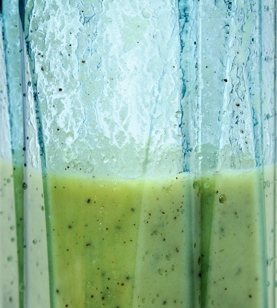 Kiwi and banana smoothie. Smoothie in blender closeup. - Photo, Image