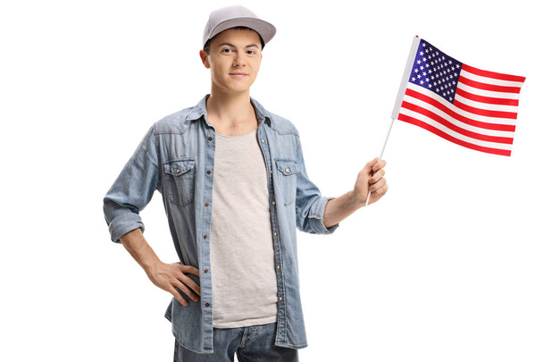 Teenager with an American flag isolated on white background - Foto, immagini
