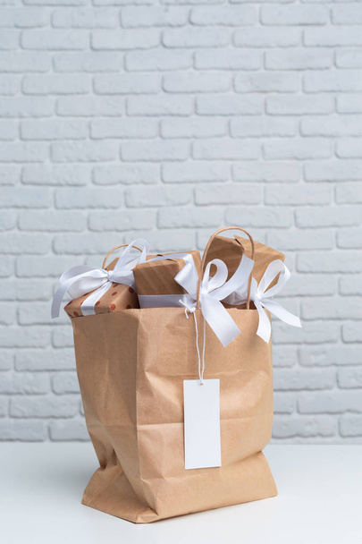 Gift box in paper shopping bag - Fotografie, Obrázek