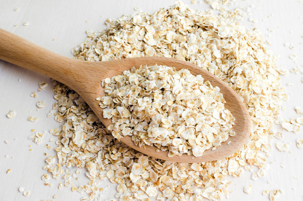 rolled oats in big spoon - Фото, изображение