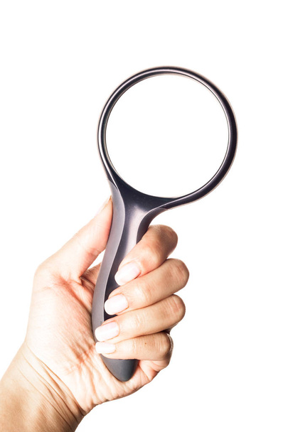Hand holding magnifying glass isolated on white background - Fotoğraf, Görsel