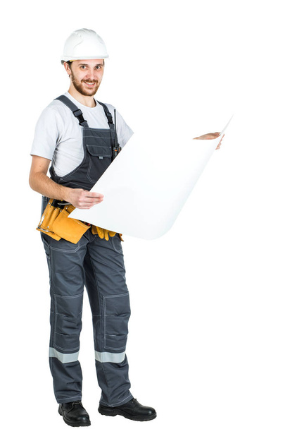 Ganzkörperporträt eines männlichen Bauunternehmers. Reparatur und Bau. isoliert auf weißem Hintergrund. - Foto, Bild