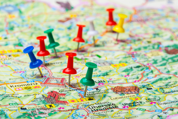 Travel destination points on a map indicated with colorful thumbtacks - Photo, Image