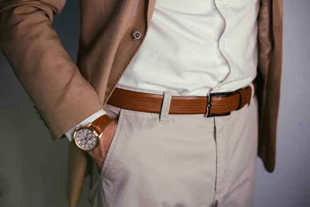 Vintage smart casual outfit outdoor.Fashion model man posing in office.Suited man posing.closeup fashion image of luxury watch on wrist of man.body detail of a business man.Not isolated. - Photo, Image