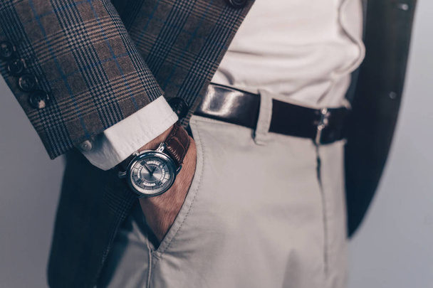 Vintage smart casual outfit outdoor.Fashion model man posing in office.Suited man posing.closeup fashion image of luxury watch on wrist of man.body detail of a business man.Not isolated. - Photo, image