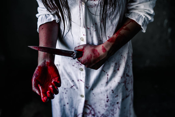  Ghost woman holding knife for kill a herself with in house. Horror. Halloween.horror of scary fear on hell is monster devil girl in halloween festival concept - Фото, зображення