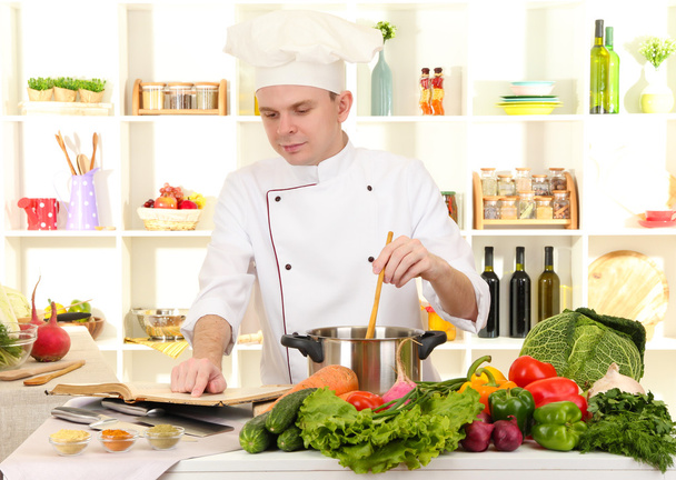 Chef cooking in kitchen - Photo, image
