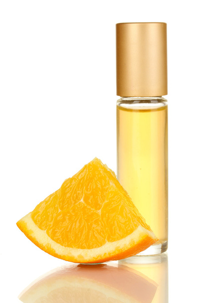 Women's perfume in beautiful bottle with orange isolated on white - Фото, изображение