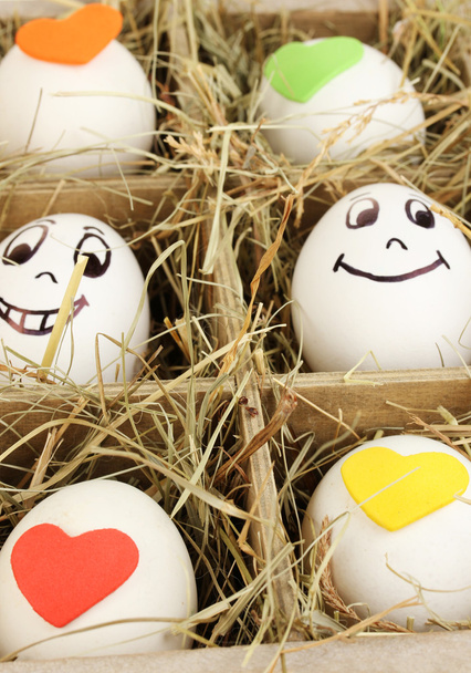 Decorative Easter eggs in wooden basket close up - Photo, Image