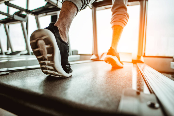 Close up on shoe,Man running in a gym on a treadmill.exercising concept.fitness and healthy lifestyle  - Foto, immagini