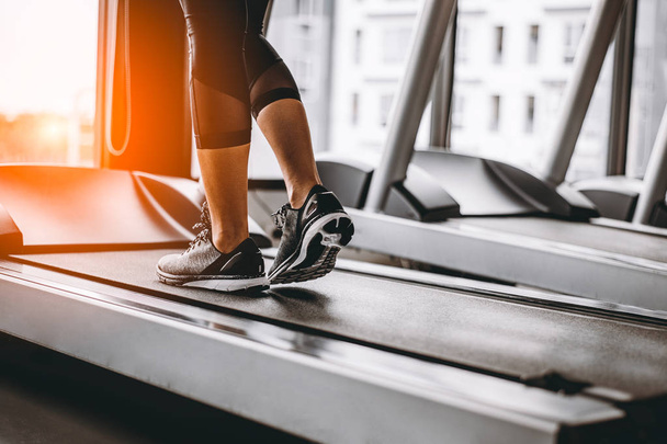Close up on shoe,Women running in a gym on a treadmill.exercising concept.fitness and healthy lifestyle  - Foto, Imagem