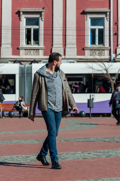 TIMISOARA, ROMANIA - MARCH 15, 2018: Man walking on the street. Real people. - Photo, Image