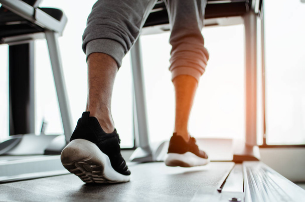 Close up on shoe,Man running in a gym on a treadmill.exercising concept.fitness and healthy lifestyle  - Foto, afbeelding