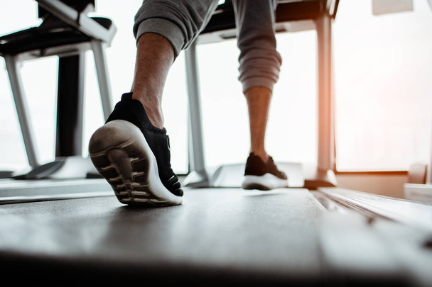 Close up on shoe,Man running in a gym on a treadmill.exercising concept.fitness and healthy lifestyle  - Fotografie, Obrázek