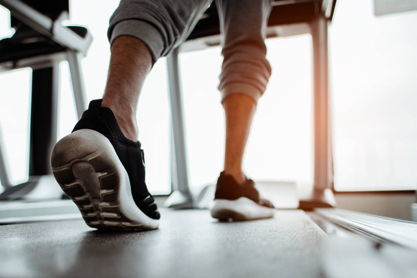 Close up on shoe,Man running in a gym on a treadmill.exercising concept.fitness and healthy lifestyle  - Foto, immagini