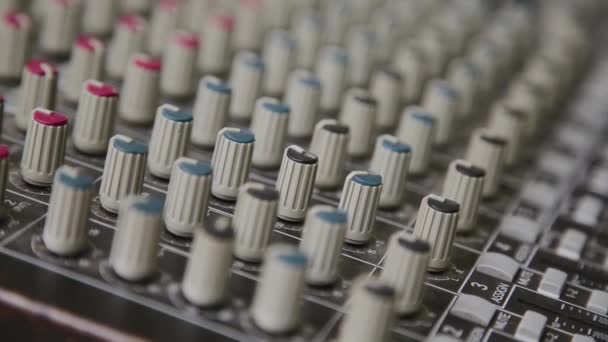 Mixing console also called audio mixer, sound board, mixing deck or mixer is an electronic device. - Footage, Video