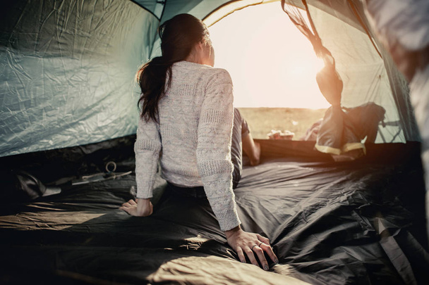 Women lie in tents.at camp. - Valokuva, kuva