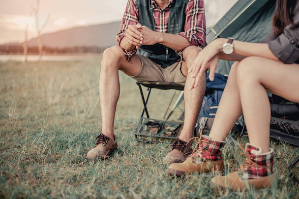man and woman sitting in chairs on camp.  - 写真・画像
