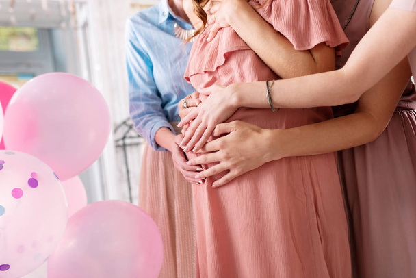 Woman wearing nice stylish bracelet touching pregnant tummy - Foto, immagini