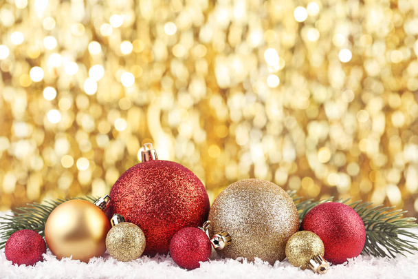 Christmas baubles with fir-tree branch on bokeh background - Photo, image