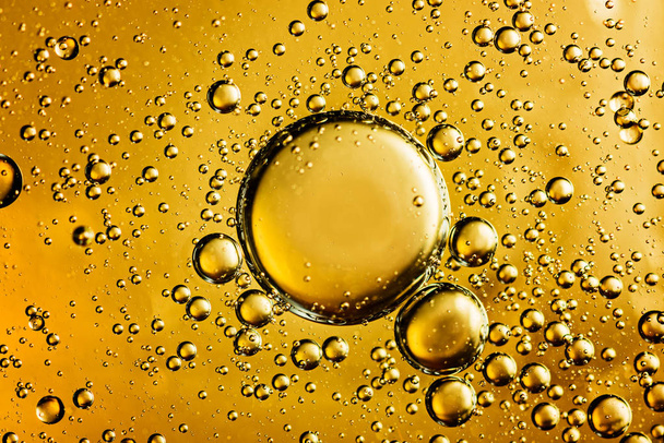 Yellow and golden  bubbles oil in water, abstract  background. - Valokuva, kuva