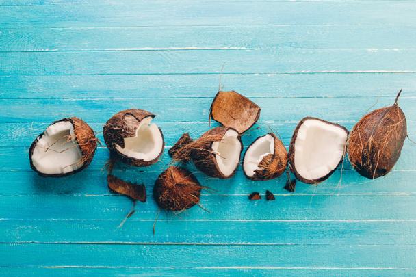 coconut, blue, background, fruit, food, fresh, healthy, wooden, oil, tropical, exotic, coco, white, diet, nut, natural, nature, table, half, top, isolated, organic, nutrition, space, milk, copy, concept - Фото, изображение
