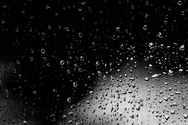 Raindrops on black glass - Foto, afbeelding