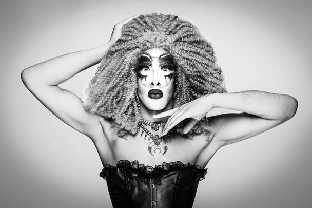 cool drag queen with spectacular makeup, glamorous stylish look, posing with   proud and  style for lgtb equality gay rights - Foto, imagen