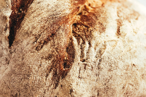 A piece of handmade freshly baked rye bread, texture background, closeup. - Фото, изображение