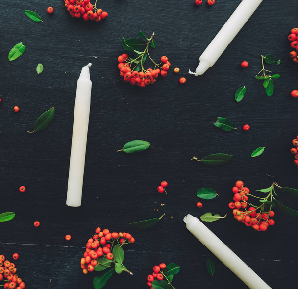 Candles flat lay top view with wild berry fruit decorative arrangement - 写真・画像