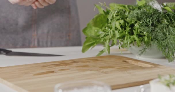 female chef cooking salad, female hands throwing tomatoes on wooden board, slow motion - Footage, Video