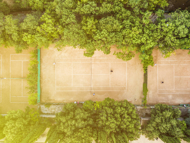 aerial sunny summer tennis courts top view from above near the sea in the city park - Photo, Image