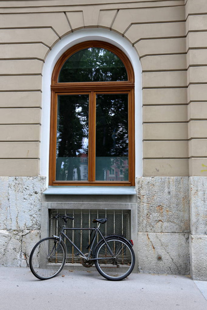 A window is an opening in the wall that serves to receive light into the room and ventilation.  - Фото, зображення